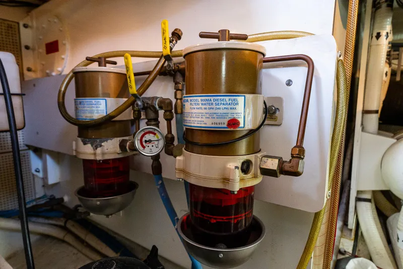 Voyageur Yacht Photos Pics Diesel fuel filters in the engine room of a 1995 Grand Banks Aft Cabin 42 Classic.