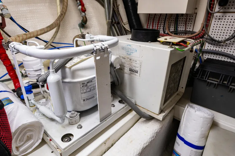 Voyageur Yacht Photos Pics 1995 Grand Banks Aft Cabin 42 Classic engine room with air conditioning unit.