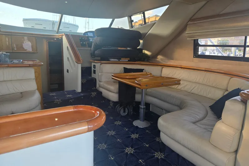 Solitude Yacht Photos Pics Luxurious interior of 1997 Sunseeker Manhattan 48 yacht with plush seating and elegant design.