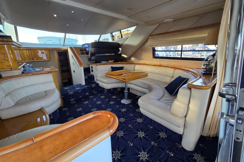 Solitude Yacht Photos Pics Luxurious interior of 1997 Sunseeker Manhattan 48 yacht with elegant seating and nautical decor.