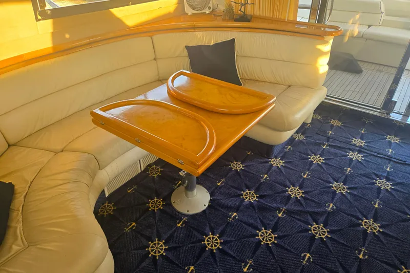 Solitude Yacht Photos Pics Luxurious Sunseeker Manhattan 48 yacht interior with elegant seating and nautical-themed carpet.