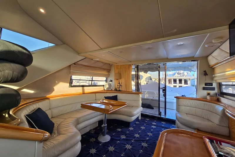 Solitude Yacht Photos Pics Luxurious interior of a 1997 Sunseeker Manhattan 48 yacht with elegant seating and decor.