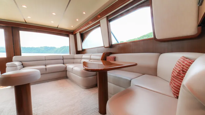 Manudito Yacht Photos Pics Luxurious interior of a 2009 Viking 50C yacht with plush seating and scenic windows.
