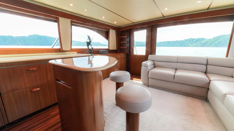 Manudito Yacht Photos Pics Luxurious interior of a 2009 Viking 50C yacht with modern furnishings and scenic views.