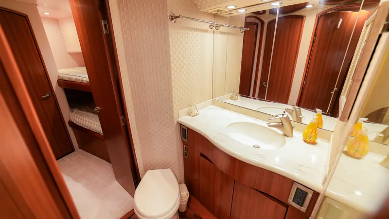 Manudito Yacht Photos Pics Luxurious bathroom in a 2009 Viking 50C yacht with modern amenities.