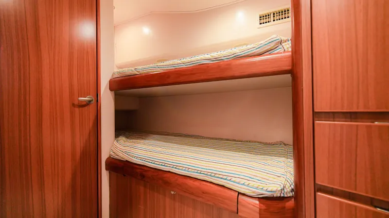 Manudito Yacht Photos Pics Bunk beds in the cabin of a 2009 Viking 50C yacht.