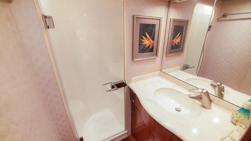Manudito Yacht Photos Pics Bathroom interior of a 2009 Viking 50C yacht with shower and sink.