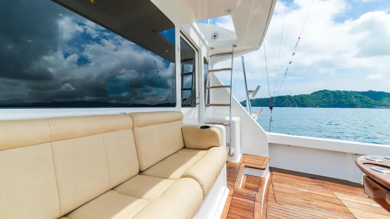 Manudito Yacht Photos Pics Luxurious seating area on a 2009 Viking 50C yacht with ocean view.