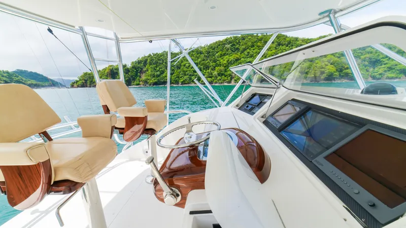 Manudito Yacht Photos Pics Luxurious helm of a 2009 Viking 50C yacht with scenic ocean view.