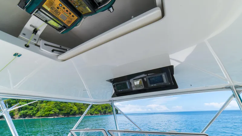 Manudito Yacht Photos Pics View from the helm of a 2009 Viking 50C yacht, overlooking the ocean.