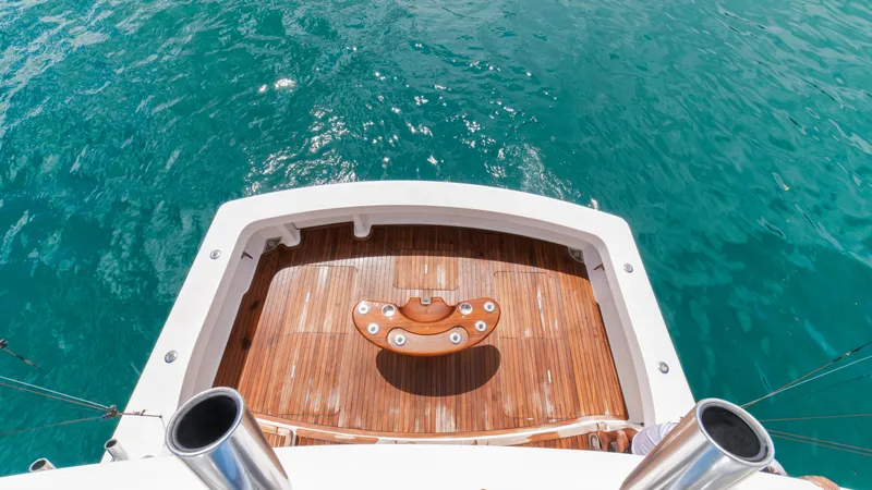 Manudito Yacht Photos Pics Aerial view of 2009 Viking 50C yacht's teak deck and ocean backdrop.