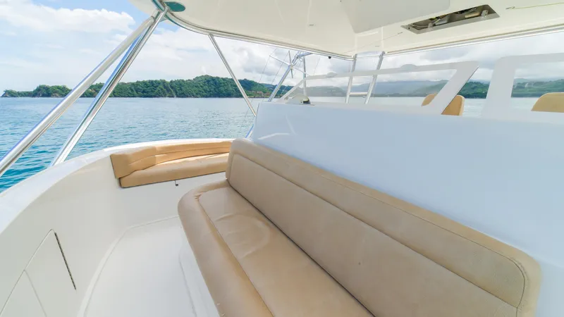 Manudito Yacht Photos Pics Interior seating area of a 2009 Viking 50C yacht with ocean view.