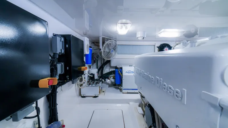 Manudito Yacht Photos Pics Engine room of a 2009 Viking 50C yacht with marine diesel engine.