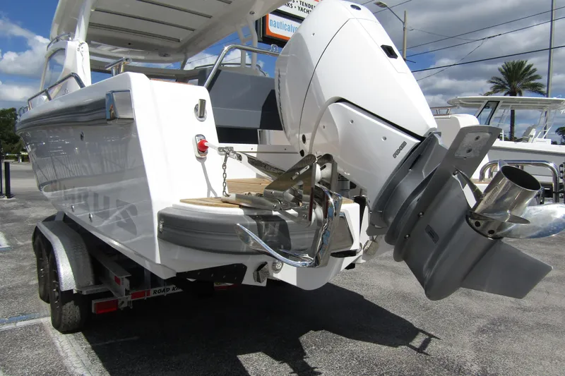  Yacht Photos Pics 2025 Nimbus Weekender 9 boat on trailer, featuring a powerful outboard motor.
