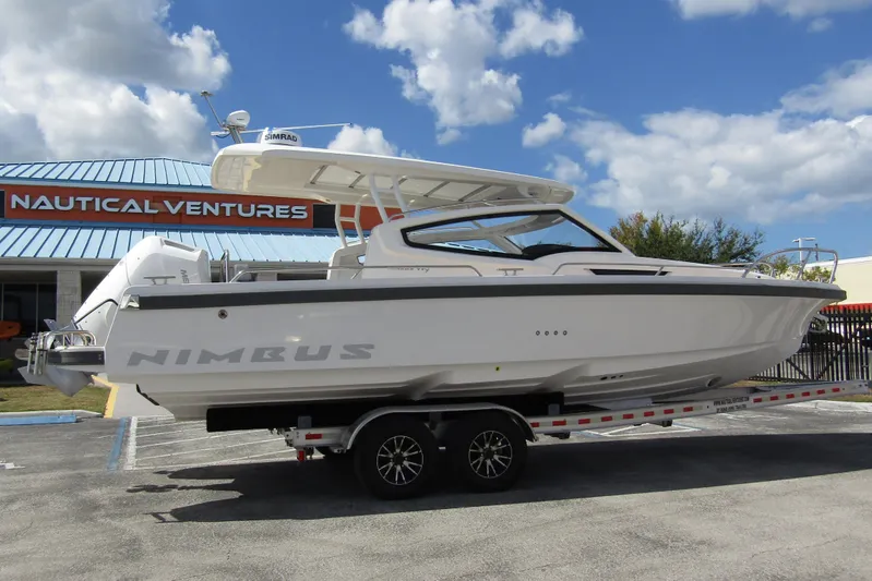  Yacht Photos Pics 2025 Nimbus Weekender 9 boat on trailer at Nautical Ventures dealership.