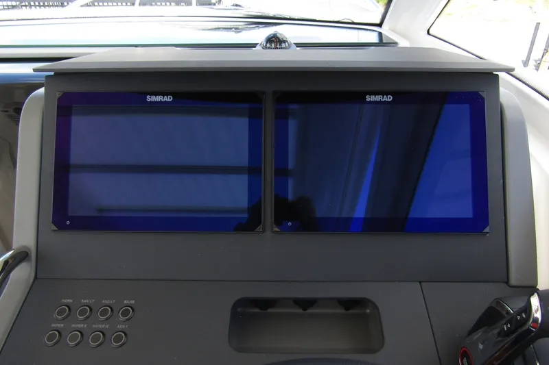  Yacht Photos Pics Dashboard of 2025 Nimbus Weekender 9 with dual Simrad displays and control panel.