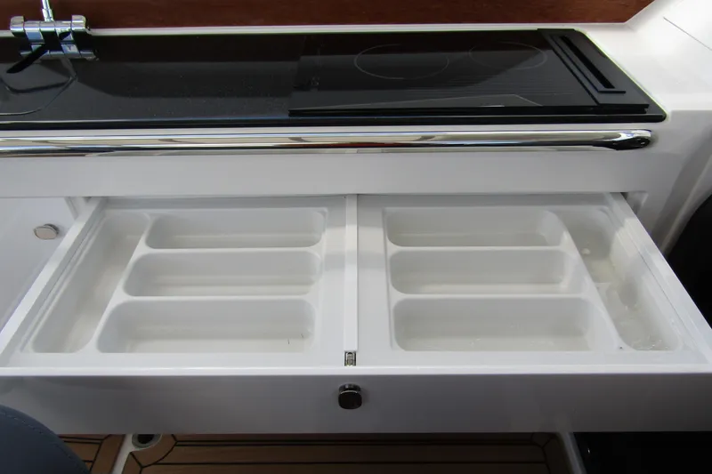  Yacht Photos Pics Open storage drawer in 2025 Nimbus Weekender 9 boat kitchen area.