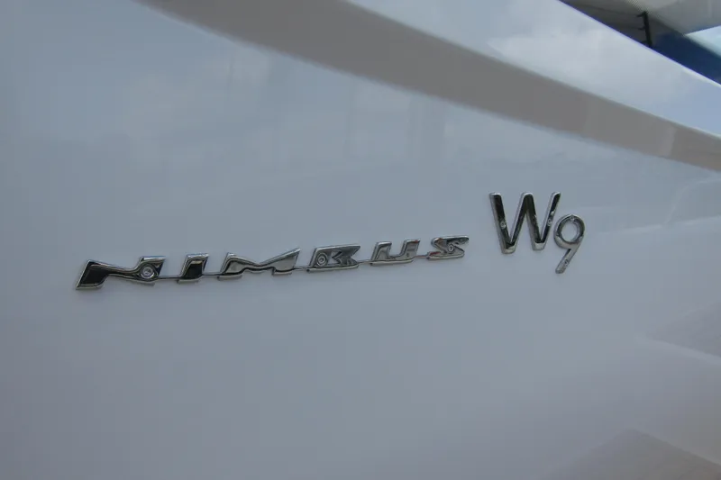  Yacht Photos Pics 2025 Nimbus Weekender 9 boat logo on sleek white surface.