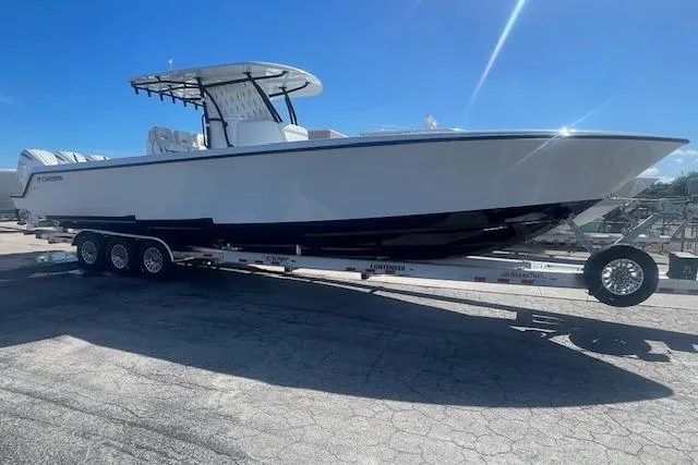  Yacht Photos Pics 2026 Contender 39 ST boat on trailer under clear blue sky.