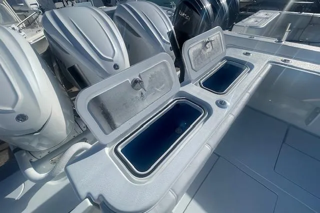  Yacht Photos Pics 2026 Contender 39 ST boat with open storage compartments and powerful outboard engines.