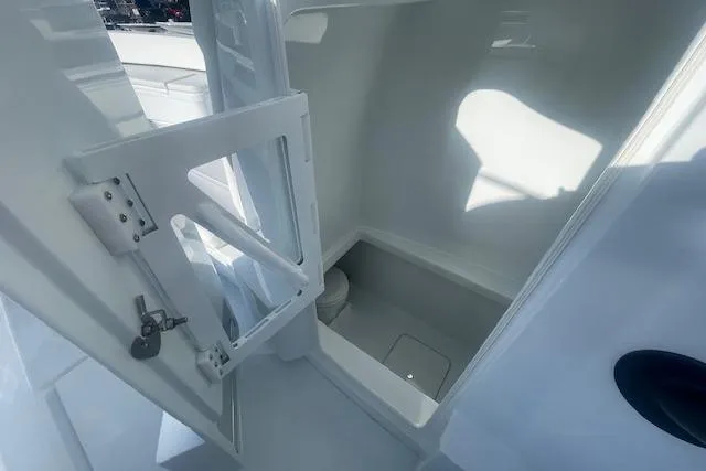  Yacht Photos Pics Interior view of 2026 Contender 39 ST boat cabin with open door.