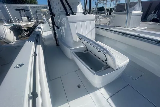  Yacht Photos Pics 2026 Contender 39 ST boat interior with open storage compartment, showcasing sleek design.