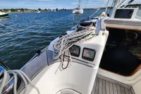 Sailing yacht Rustler 33 cockpit view, 2017 model, with ropes and instruments, on a sunny day.