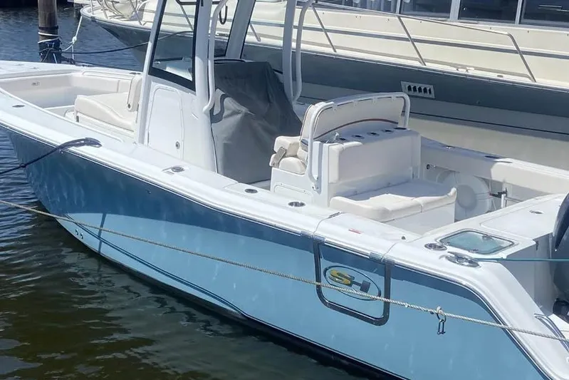  Yacht Photos Pics 2021 Sea Hunt Gamefish 27 Coffin Box boat docked in marina, featuring sleek design.