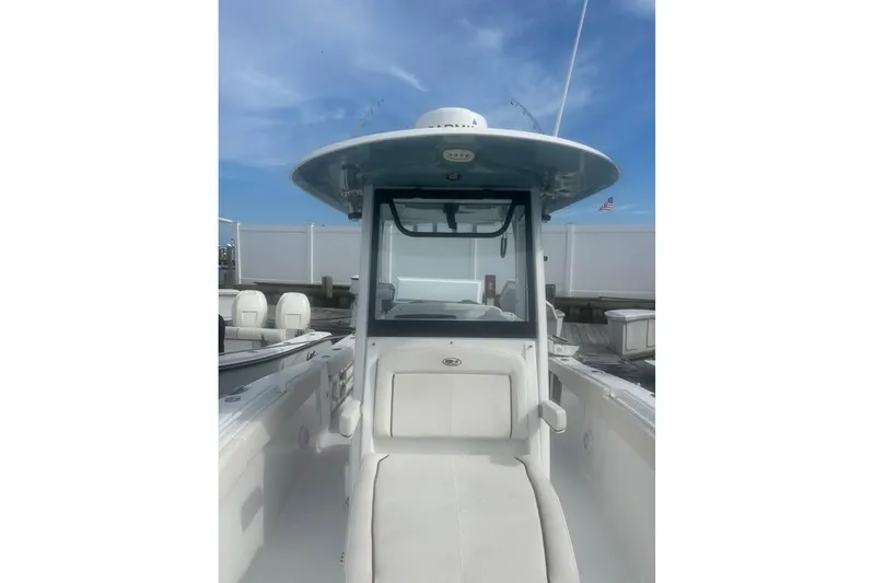  Yacht Photos Pics 2021 Sea Hunt Gamefish 27 Coffin Box boat, center console view, docked under blue sky.