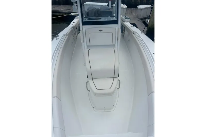  Yacht Photos Pics 2021 Sea Hunt Gamefish 27 Coffin Box boat interior, featuring sleek white seating and deck.