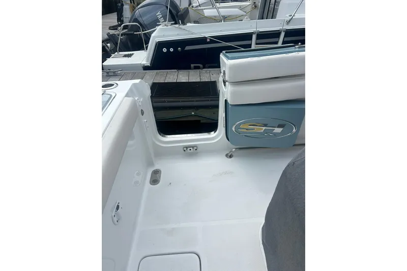  Yacht Photos Pics 2021 Sea Hunt Gamefish 27 Coffin Box boat interior with open storage compartment.