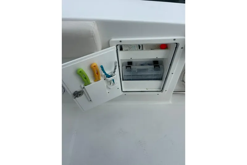  Yacht Photos Pics 2021 Sea Hunt Gamefish 27 Coffin Box storage compartment with tools and tackle box.