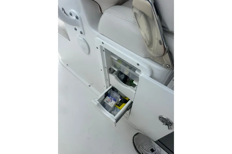  Yacht Photos Pics Storage compartment on 2021 Sea Hunt Gamefish 27 Coffin Box boat, featuring open drawer.