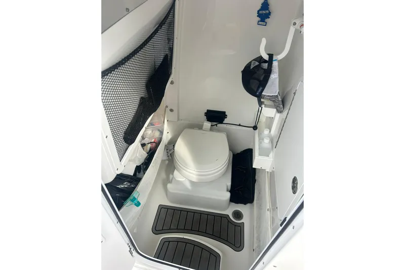 Yacht Photos Pics 2021 Sea Hunt Gamefish 27 Coffin Box boat interior with toilet and storage.