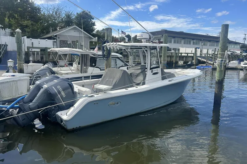  Yacht Photos Pics 2021 Sea Hunt Gamefish 27 Coffin Box boat docked at marina with Yamaha engines.