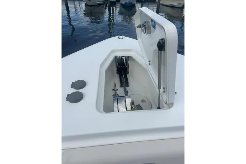  Yacht Photos Pics Open anchor compartment on 2021 Sea Hunt Gamefish 27 Coffin Box boat, docked by water.
