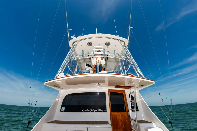 Carolina Girl Yacht Photos Pics 1993 Jarrett Bay Convertible yacht on open sea under clear blue sky.