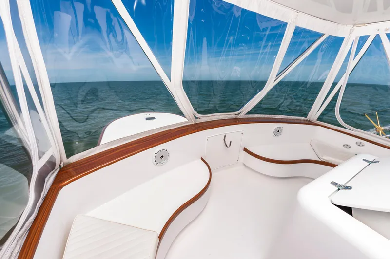 Carolina Girl Yacht Photos Pics 1993 Jarrett Bay Convertible boat interior with ocean view through clear windows.