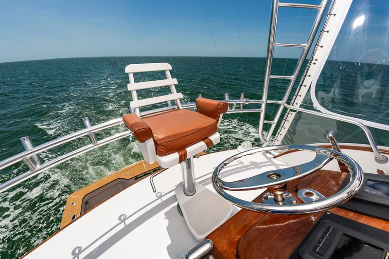 Carolina Girl Yacht Photos Pics 1993 Jarrett Bay Convertible yacht helm with ocean view and captain's chair.