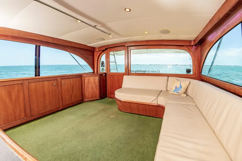 Carolina Girl Yacht Photos Pics Luxurious 1993 Jarrett Bay Convertible yacht interior with ocean view and plush seating.