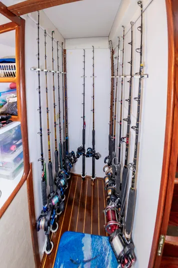 Carolina Girl Yacht Photos Pics Fishing rods neatly stored in a 1993 Jarrett Bay Convertible boat's cabin.