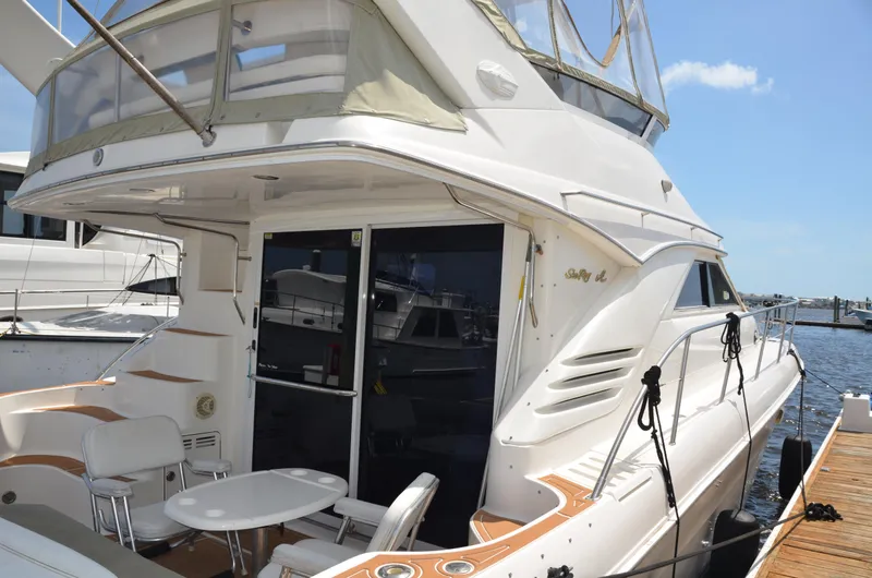 Don't Blink Yacht Photos Pics 2000 Sea Ray 400 Sedan Bridge yacht docked, featuring spacious deck and sleek design.