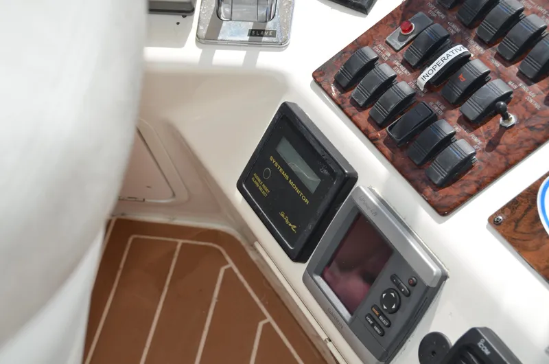 Don't Blink Yacht Photos Pics Control panel of a 2000 Sea Ray 400 Sedan Bridge yacht with switches and displays.