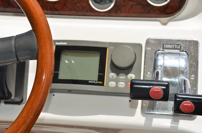 Don't Blink Yacht Photos Pics Steering wheel and throttle controls on 2000 Sea Ray 400 Sedan Bridge yacht.
