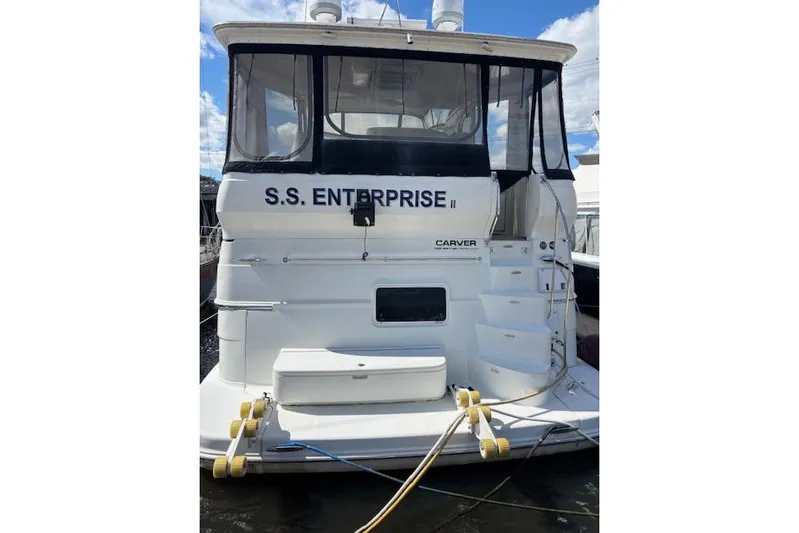  Yacht Photos Pics 2004 Carver 466 Motor Yacht docked, named "S.S. Enterprise II," with visible rear view.