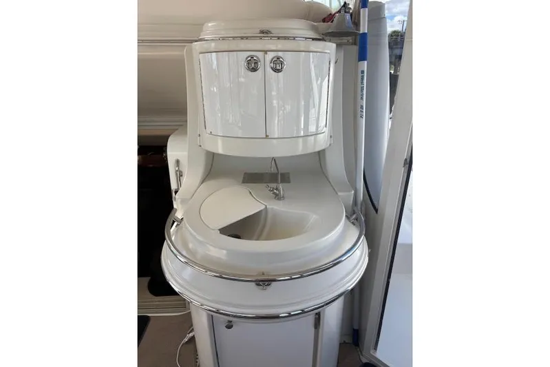  Yacht Photos Pics 2004 Carver 466 Motor Yacht interior sink with storage cabinets.