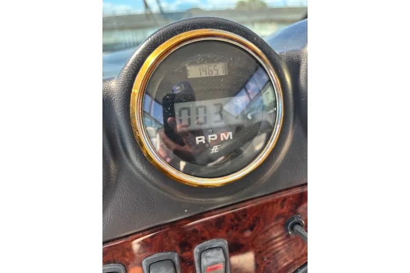  Yacht Photos Pics Close-up of 2004 Carver 466 Motor Yacht RPM gauge displaying 1465.