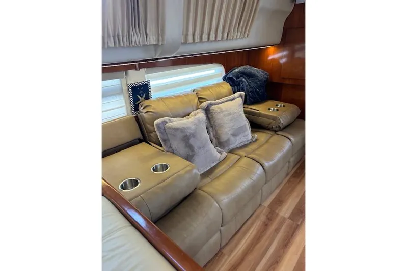  Yacht Photos Pics Luxurious interior of 2004 Carver 466 Motor Yacht with plush seating and cushions.