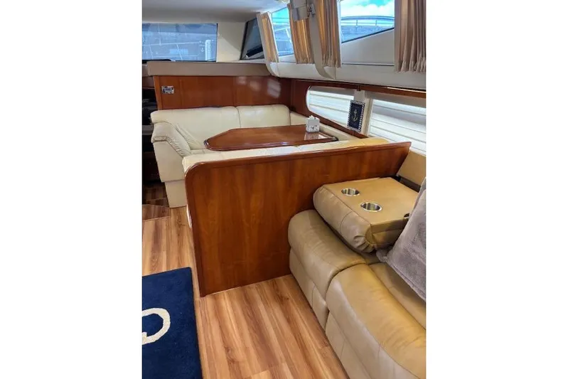  Yacht Photos Pics Luxurious interior of 2004 Carver 466 Motor Yacht with leather seating and wood accents.