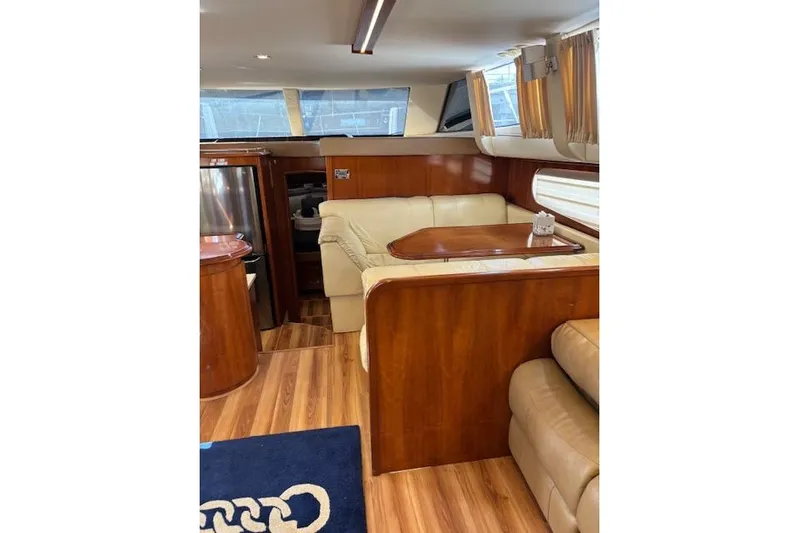  Yacht Photos Pics Interior of 2004 Carver 466 Motor Yacht with elegant wood and leather furnishings.
